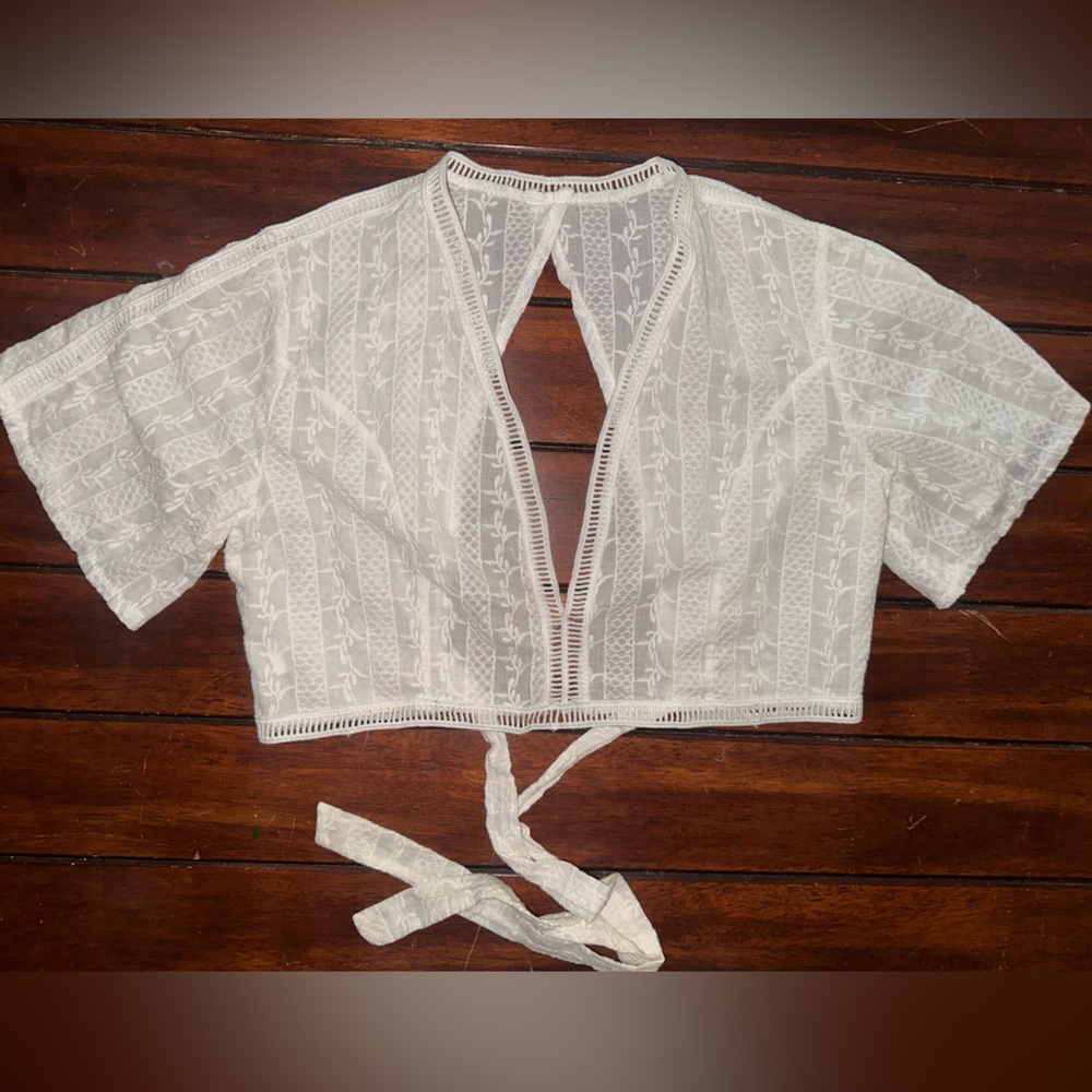 Women’s size medium/large white open back crop top
